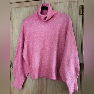 Oversized pink turtleneck sweater
